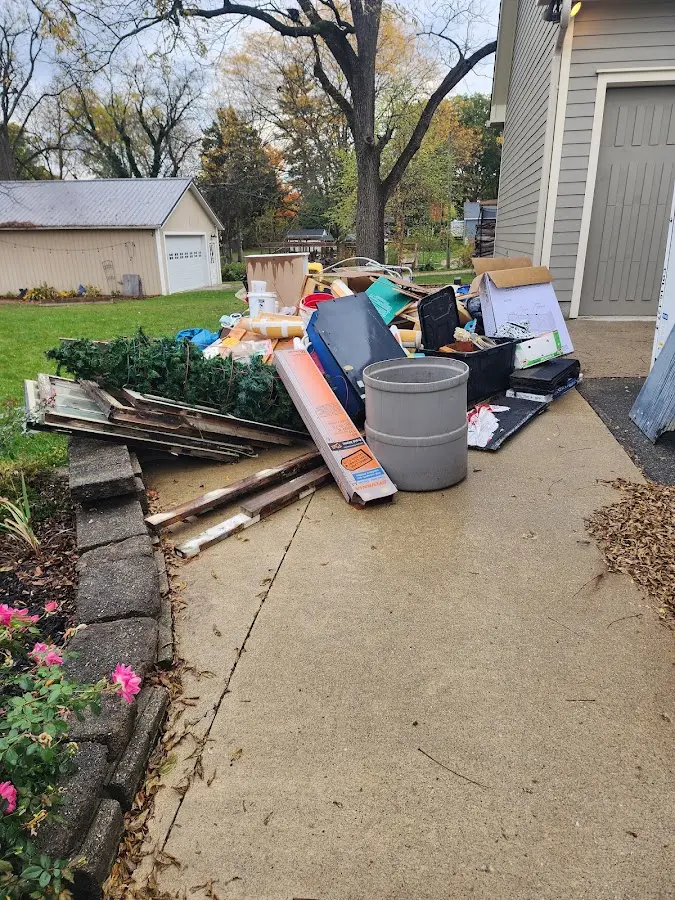 Dumpster being loaded with debris for Estate Cleanout Dumpster Rental in Lower Macungie